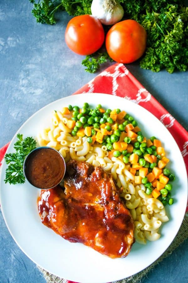 Family favorite Oven BBQ Pork Chops are marinaded and coated with tangy barbecue sauce for  an easy dinner everyone will love!