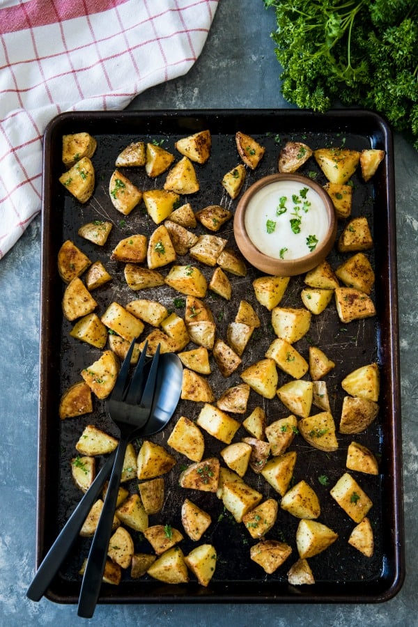 Oven Roasted Garlic Potatoes - crispy on the outside and fluffy inside. The garlic and spices add delicious savory flavor with every bite.#mustlovehomecooking #ovenpotatoes