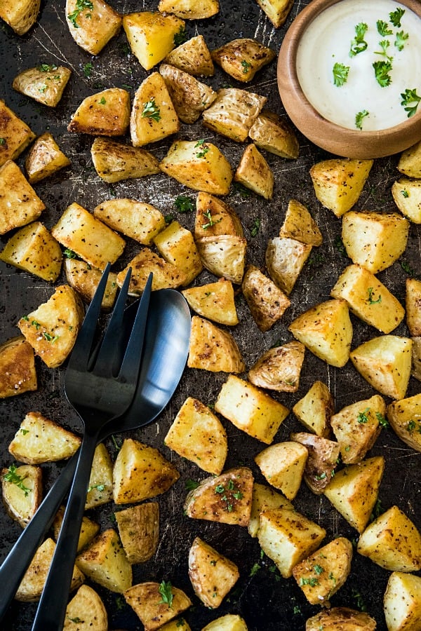 Oven Roasted Garlic Potatoes - crispy on the outside and fluffy inside. The garlic and spices add delicious savory flavor with every bite.#mustlovehomecooking #ovenpotatoes