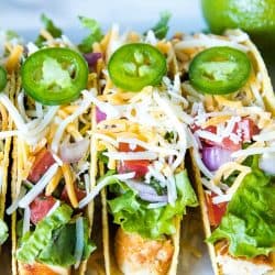 Lime Marinated Chicken Tacos are grilled, fresh lime marinated chicken breasts stuffed into crunchy taco shells and loaded with your favorite toppings. #mustlovehomecooking #mexicanfood #tacorecipes