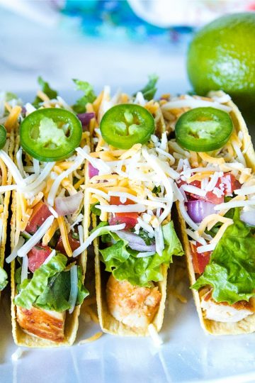 Lime Marinated Chicken Tacos are grilled, fresh lime marinated chicken breasts stuffed into crunchy taco shells and loaded with your favorite toppings. #mustlovehomecooking #mexicanfood #tacorecipes