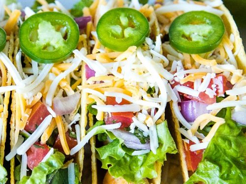 Lime Marinated Chicken Tacos are grilled, fresh lime marinated chicken breasts stuffed into crunchy taco shells and loaded with your favorite toppings. #mustlovehomecooking #mexicanfood #tacorecipes