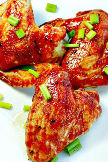 Crispy, fiery Asian Chicken Wings slathered with a combination of three different hot sauces - perfect smokin' hot wings every time!