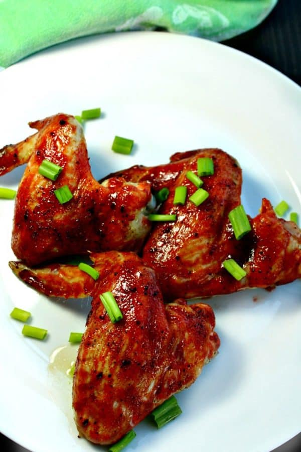 Crispy, fiery Asian Chicken Wings slathered with a combination of three different hot sauces - perfect smokin' hot wings every time!
