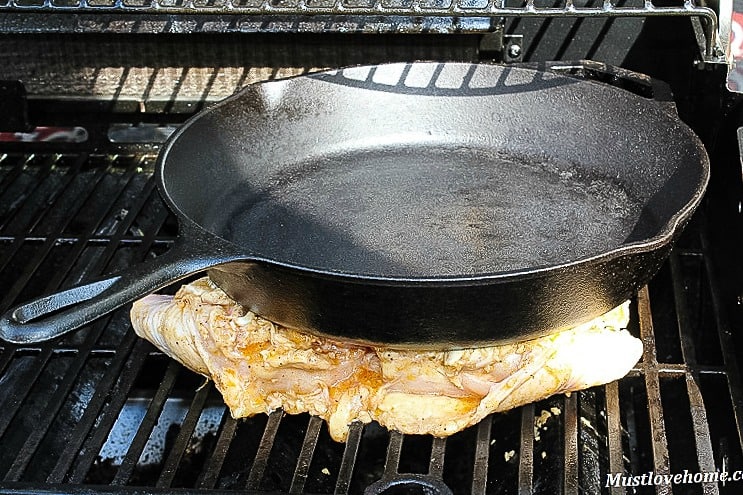 Crispy Chicken Under a Brick - seared and pressed on the grill under a heavy weight, making chicken that is crunchy on the outside with tender juices inside.