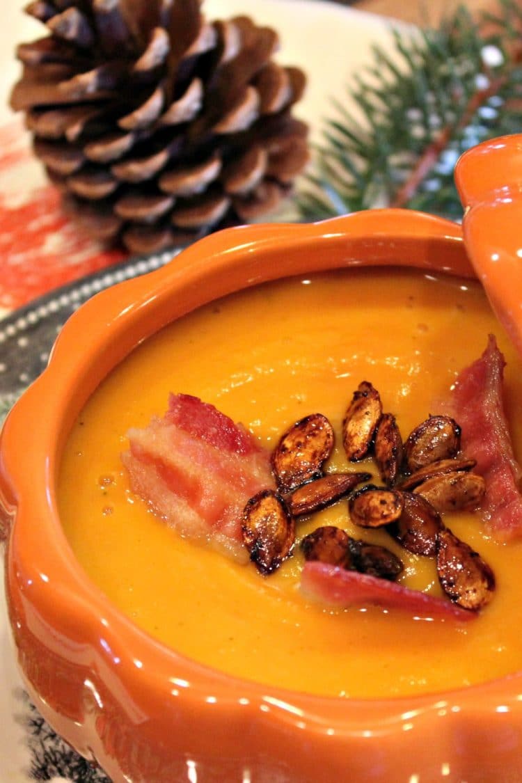 Warm and creamy, Roasted Butternut Squash Soup is comfort in a bowl. Rich oven-roasted squash, apples and onions are the base for this easy fall soup - so elegant when served in pumpkin bowls!