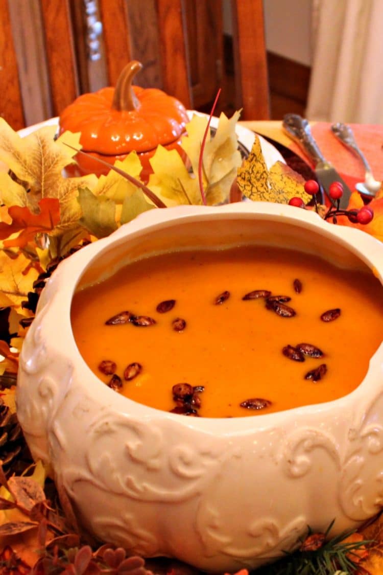 Warm and creamy, Roasted Butternut Squash Soup is comfort in a bowl. Rich oven-roasted squash, apples and onions are the base for this easy fall soup - so elegant when served in pumpkin bowls!