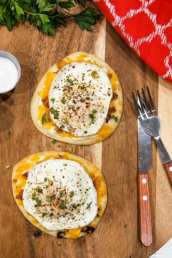 Naan Bread Breakfast Pizza with cream cheese, chives, bacon and cheese is totally delicious and an easy crowd favorite! It's ready in 10 minutes! #mustlovehomecooking