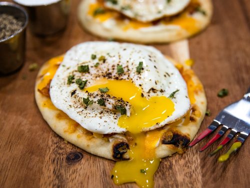 Naan Bread Breakfast Pizza with cream cheese, chives, bacon and cheese is totally delicious and an easy crowd favorite! It's ready in 10 minutes! #mustlovehomecooking
