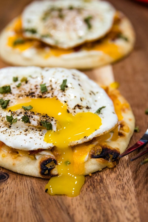 Naan Bread Breakfast Pizza with cream cheese, chives, bacon and cheese is totally delicious and an easy crowd favorite! It's ready in 10 minutes! #mustlovehomecooking