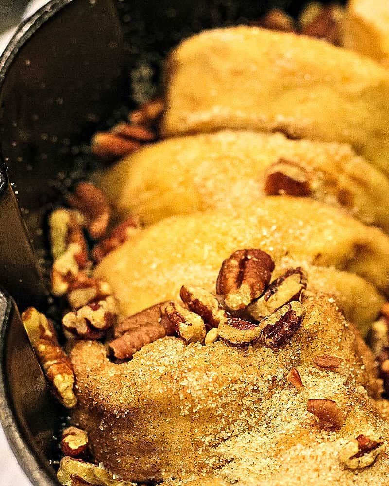 Cinnamon Walnut Monkey Bread is a maple sweet pan of pull-apart biscuits dripping with buttery caramel and toasty nuts. Deliciously easy to make and perfect for make-ahead and freezing!