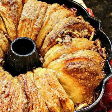 Cinnamon Walnut Monkey Bread is a maple sweet pan of pull-apart biscuits dripping with buttery caramel and toasty nuts. Deliciously easy to make and perfect for make-ahead and freezing! #mustlovehomecooking