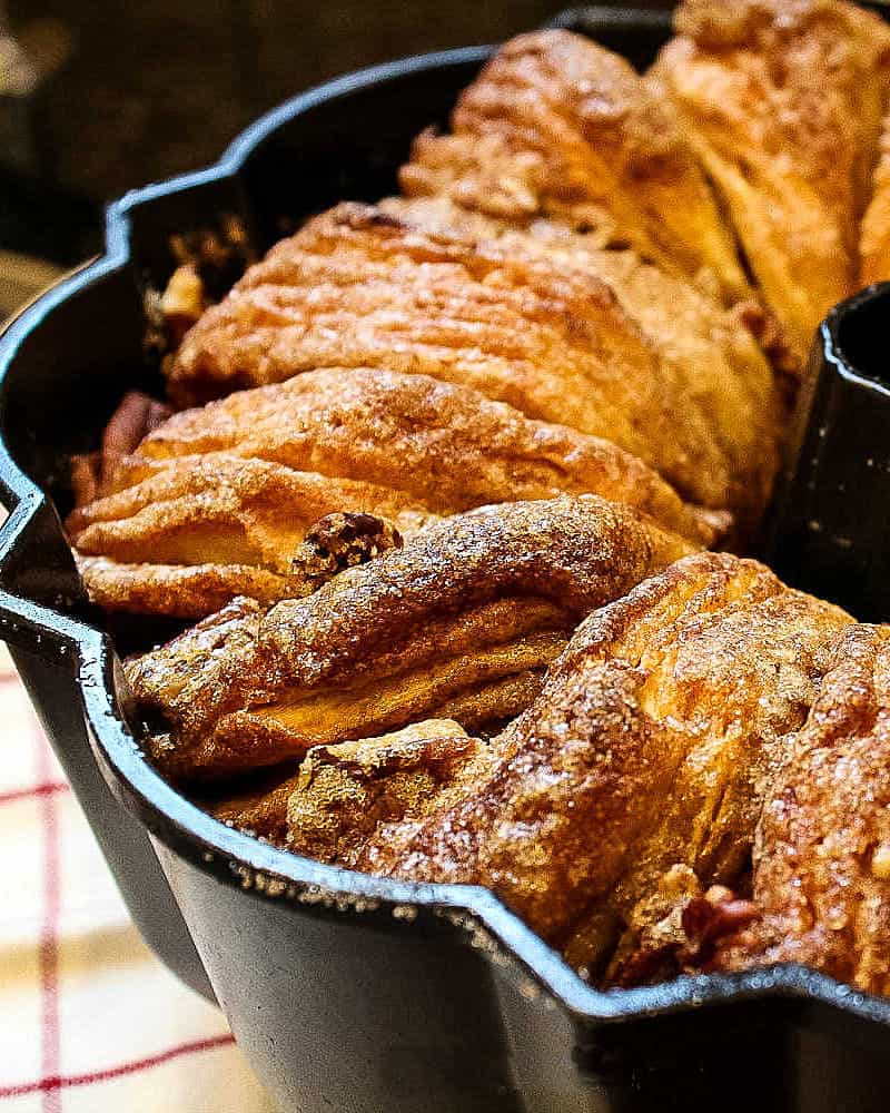 Cinnamon Walnut Monkey Bread is a maple sweet pan of pull-apart biscuits dripping with buttery caramel and toasty nuts. Deliciously easy to make and perfect for make-ahead and freezing! #mustlovehomecooking