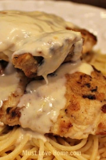 Love Lemon Chicken? Then you will love this crispy pan fried chicken breast with a smooth creamy lemon sauce! Served over pasta this dish is a delicious and filling meal! This simple recipe is perfect for the beginner cook and it will look like you spent hours in the kitchen!!