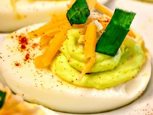 Tex Mex Spicy Deviled Eggs. It's a twist on the classic recipe with cheddar cheese, jalapeno, and chipotle pepper spice. South of the Border never tasted so good! Mustlovehomecooking