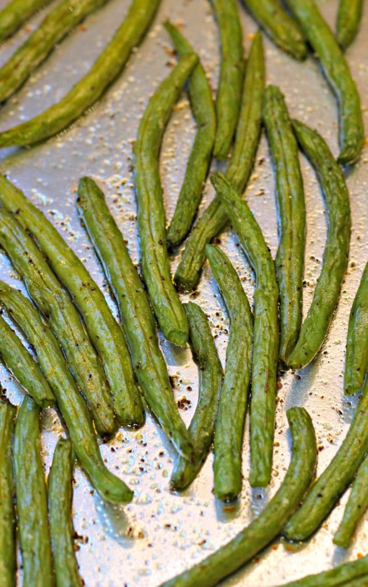 Oven Roasted Green Beans are easy peasy to make. Toss on a baking pan with olive oil, salt and pepper then pop in the oven. The Green beans come out with a yummy smokey flavor that will have you roasting all of your vegetables!