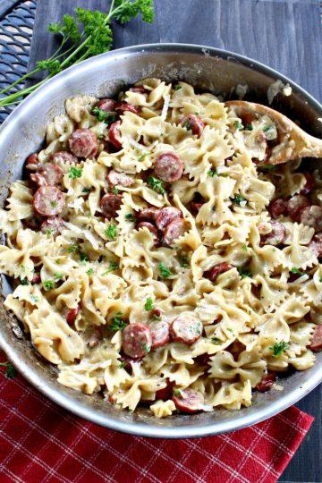 New Orleans Style Smoked Sausage Alfredo is a delicious combination of sausage, pasta, cream, parmesan cheese, Cajun seasonings and garlic.