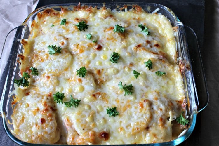 Rich and creamy Country Ham and Potato Bake is pure southern comfort food. Delicious chunks of ham, bathed in a rich cream sauce under a melted layer of cheese is great for brunch or dinner, and can be made ahead!