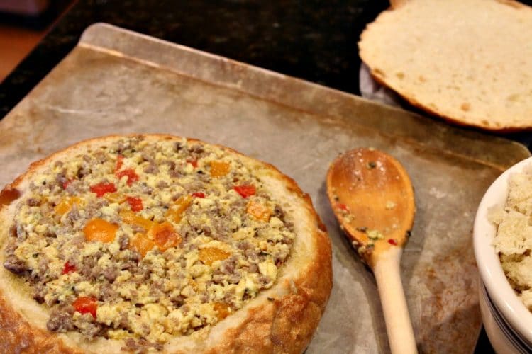 Sausage Egg Bowl - A crunchy Italian bread bowl filled with savory sausage, eggs, cheese and spices - perfect recipe to create a centerpiece dish for your next brunch or dinner!
