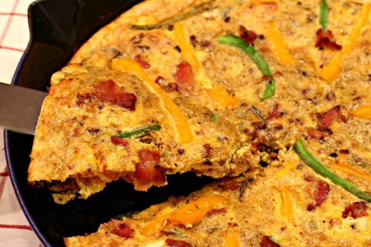 A Southwest Bacon Frittata, on the table in less than 30 minutes! So quick and easy as a weeknight dinner or fancy brunch! And it can be made ahead of time!!