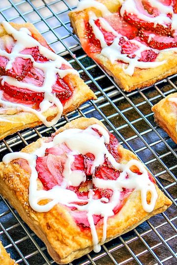 Crisp, sugar dusted puff pastry with juicy slices of strawberry baked on top.