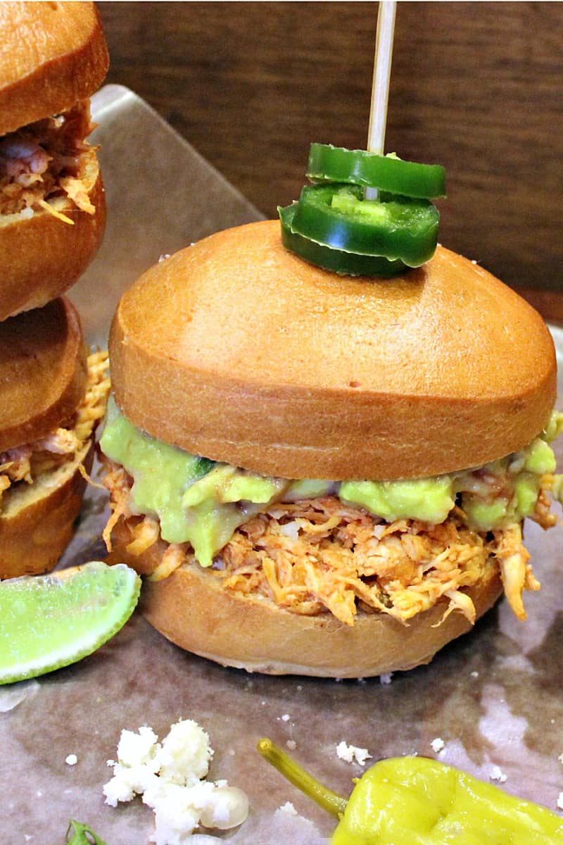 Mini Mexican Tortas are little sandwiches filled with spicy chicken, guacamole and Queso Fresco served up on a warm toasted roll.