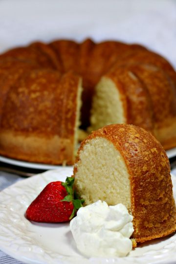 Perfect Pound Cake is buttery and sweet, with a hint of vanilla. This cake is rich, with the flavor of shortbread cookies, but still light as a feather. Serve with fresh whipped cream and berries as a fancy dessert or brunch dish - can also be made ahead and frozen.#mustlovehomecooking
