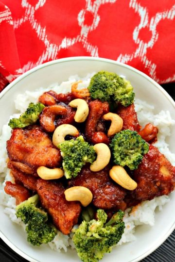 Put down that take-out menu! Slow Cooker Cashew Chicken - a zesty blend of chicken, cashews and a spicy sauce has your favorite fast food beat...hands down! Served with rice and broccoli it is a complete meal!
