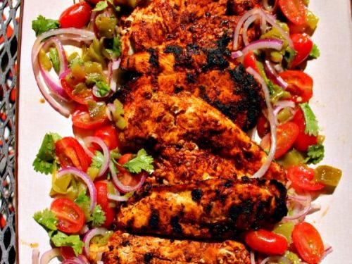Harissa Chicken are grilled chicken breasts that have been marinated with a harissa rub of paprika, chipotle chilies, adobo sauce and cumin then served with a refreshing cilantro salad. Great alone or used as taco filling or the base for spicy chicken salad!