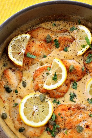 Pan fried chicken breasts smothered in a creamy lemon garlic sauce, this Lemon Garlic Chicken Piccata will keep everyone coming back for more! Parmesan cheese, basil and capers take the already amazing flavor over the top!