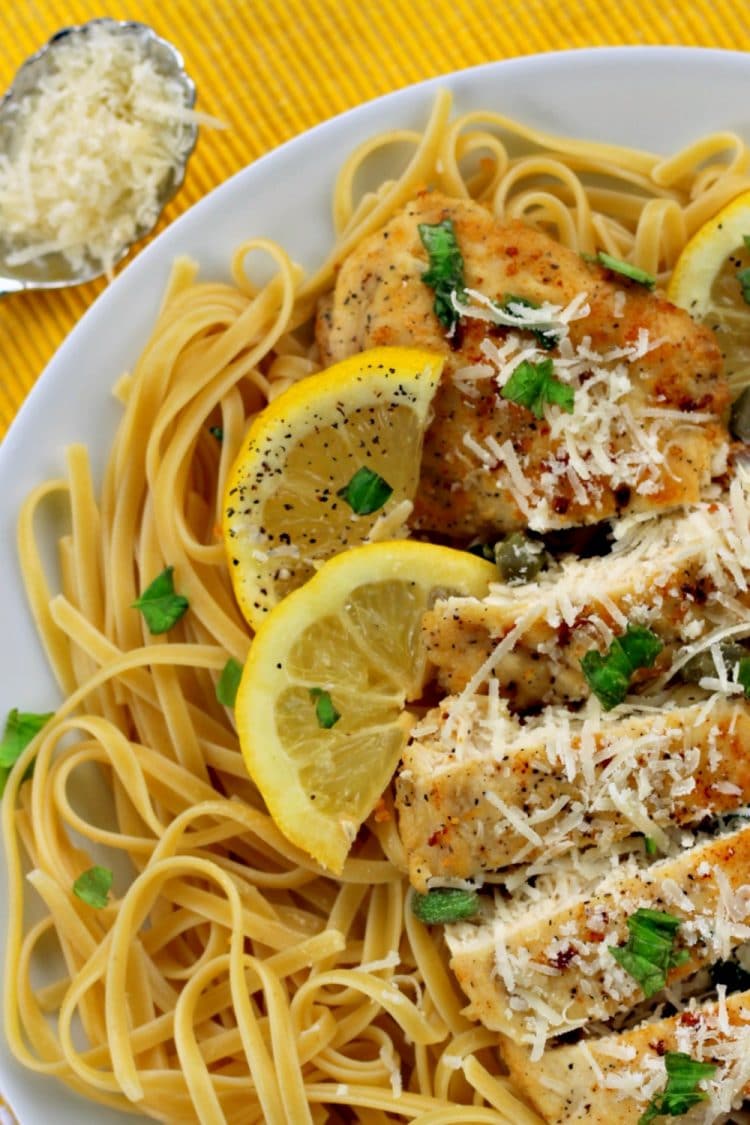 Pan fried chicken breasts smothered in a creamy lemon garlic sauce, this Lemon Garlic Chicken Piccata will keep everyone coming back for more! Parmesan cheese, basil and capers take the already amazing flavor over the top!