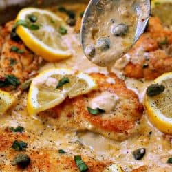 Pan fried chicken breasts smothered in a creamy lemon garlic sauce, this Lemon Garlic Chicken Piccata will keep everyone coming back for more! Parmesan cheese, basil and capers take the already amazing flavor over the top!