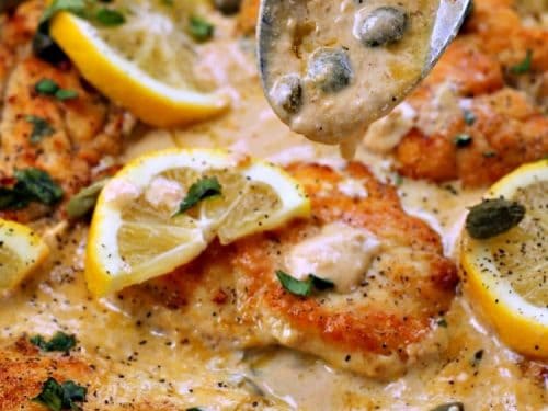 Pan fried chicken breasts smothered in a creamy lemon garlic sauce, this Lemon Garlic Chicken Piccata will keep everyone coming back for more! Parmesan cheese, basil and capers take the already amazing flavor over the top!