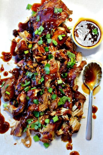 Slow Cooker Garlic Honey Chicken is tender, slow cooked chicken breasts covered in a sweet, spicy garlic sauce that will have everyone asking for seconds!