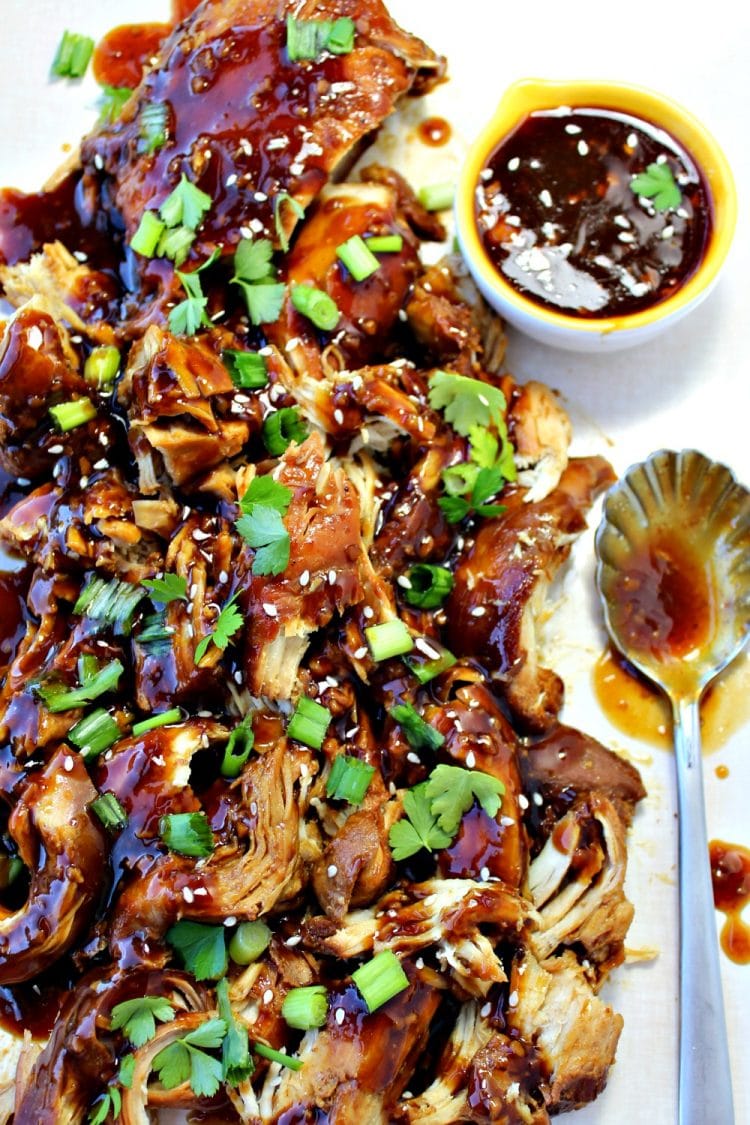 This Slow Cooker Garlic Honey Chicken is tender, slow cooked chicken breasts covered in a sweet, spicy garlic sauce that will have everyone asking for seconds!