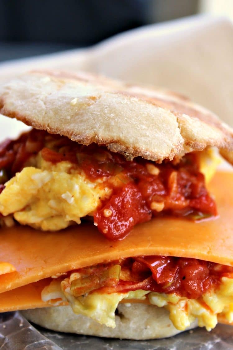 Egg and Cheese Breakfast Sandwich with Smoked Scallion Sauce is packed with flavor from the incredible smoky tomato sauce. Smoked paprika is the secret to the sauce! You will want to double the recipe to pile on burgers and steaks too!
