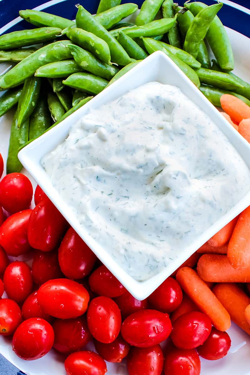 Easy Herb Dill Dip is a smooth, light dip made with only sour cream and seasonings.  Perfect for veggies, crackers and chips. #mustlovehomecooking