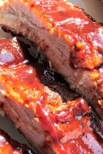 Dry Rub Slow Cooker Ribs are savory, baby back ribs that are fall-off the bone tender. The secret to their amazing flavor is to slather the ribs with a brown sugar and spice dry rub before cooking. Finish with your favorite BBQ sauce under the broiler or on the grill!