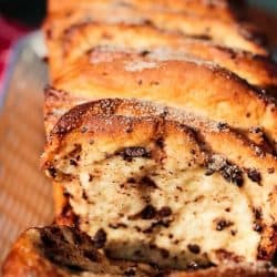 Chocolate Pumpkin Spice Pull Apart Bread is full of autumn flavors. Chocolate chips, pumpkin pie spice and frozen bread dough for an easy recipe that anyone can make.