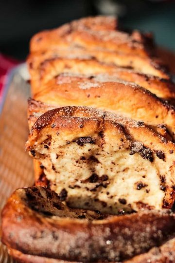 Chocolate Pumpkin Spice Pull Apart Bread is full of autumn flavors. Chocolate chips, pumpkin pie spice and frozen bread dough for an easy recipe that anyone can make.
