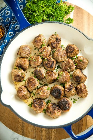 Easy Skillet Meatballs are savory bites of beef, onion, caraway seeds and spices that you can add to pasta, soups or sandwiches for an easy meal. Great for making ahead and freezing. #mustlovehomecooking