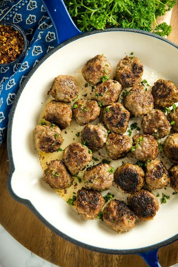 Easy Skillet Meatballs are savory bites of beef, onion, caraway seeds and spices that you can add to pasta, soups or sandwiches for an easy meal. Great for making ahead and freezing. #mustlovehomecooking