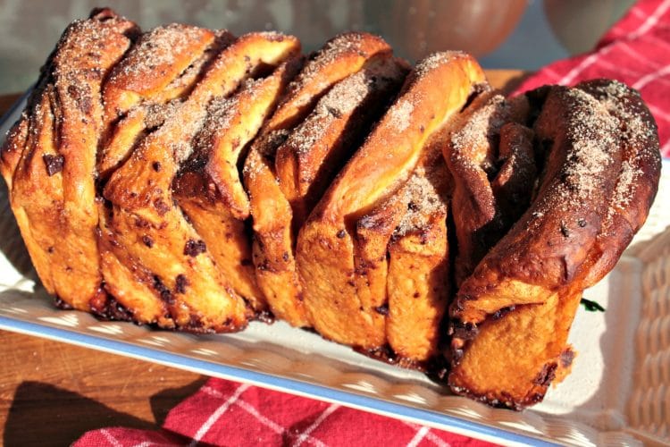 Chocolate Pumpkin Spice Pull Apart Bread is a soft, buttery loaf chock full of autumn flavors. Chocolate chips, pumpkin pie spice and frozen bread dough combine in this easy recipe that anyone can make.