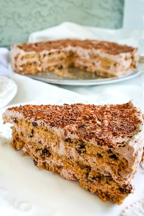 Velvety whipped cream filling and crunchy cookies makes this no-bake Chocolate Chip Cookie Ice Box cake the perfect dessert for all your special occasions. #mustlovehomecooking