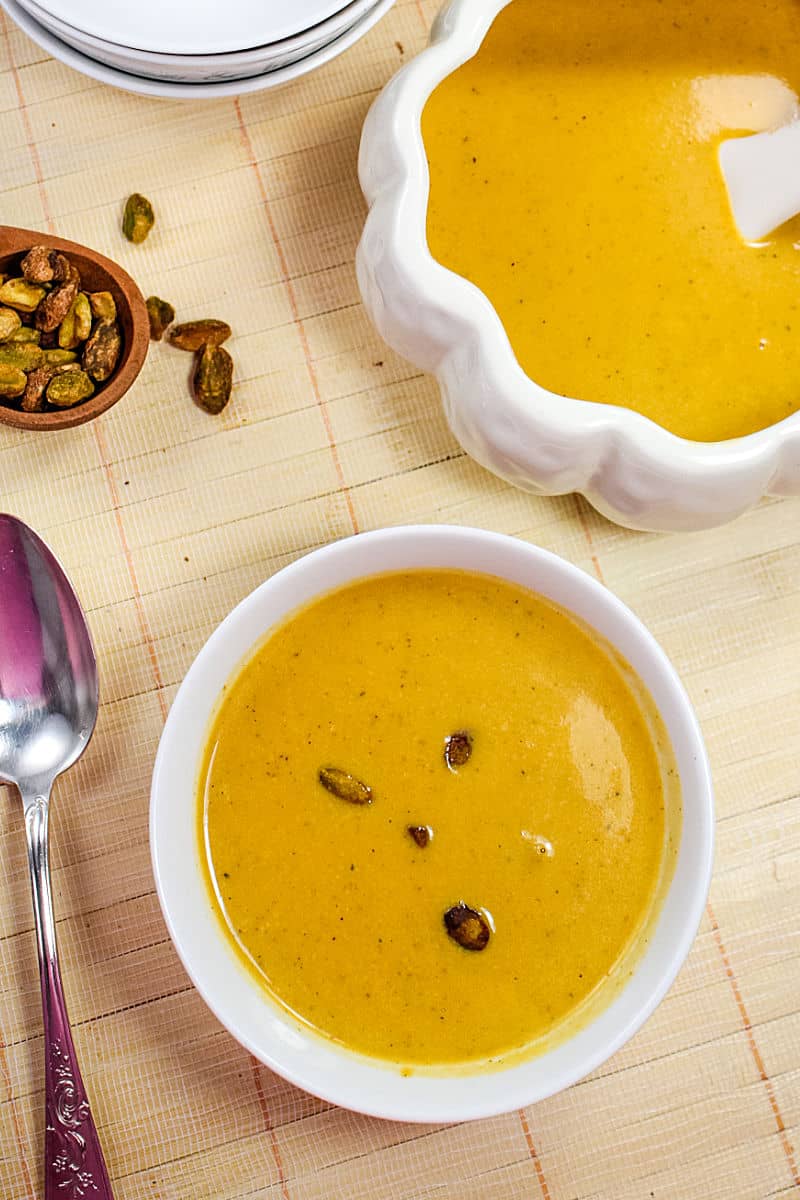 Harvest Pumpkin Soup is a creamy blend of pumpkin, broth and cream served warm with pistachios sprinkled on top. #mustlovehomecooking