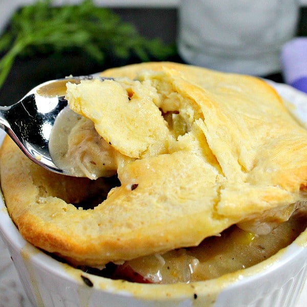 Slow Cooker Chicken Pot Pie is chicken, vegetables and savory gravy, topped with a flaky crust.