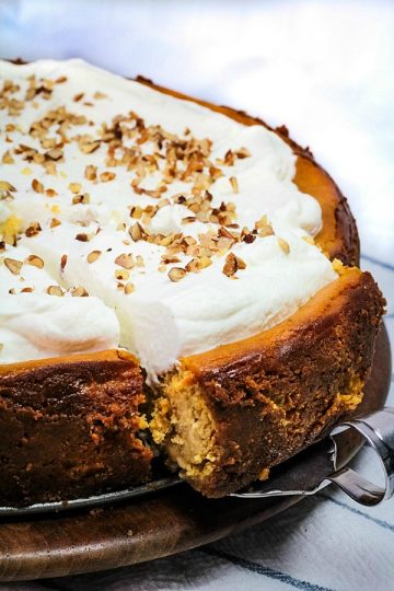 Fall parties and holidays are extra special with a rich and creamy homemade Brown Sugar Pumpkin Cheesecake. Packed with seasonal flavor in every bite! #mustlovehomecooking