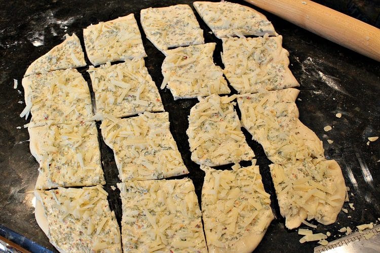 Garlic Parmesan Pull Apart Bread is a soft, buttery loaf loaded with flavor. It looks fancy but it could not be easier to make. No yeast or kneading to worry about because this recipe uses frozen bread dough!