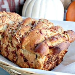 Garlic Parmesan Pull Apart Bread is a rustic, buttery loaf loaded with flavor. It looks fancy but it could not be easier to make. No yeast or kneading to worry about because this recipe uses frozen bread dough!