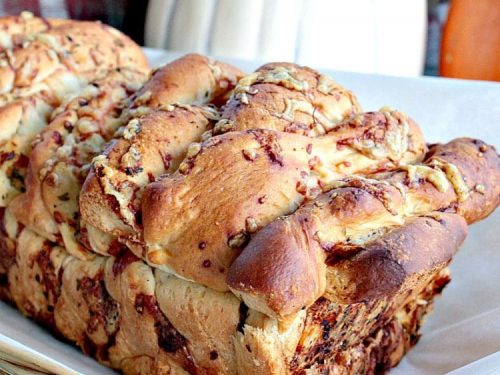 Garlic Parmesan Pull Apart Bread is a rustic, buttery loaf loaded with  flavor. It looks fancy but it could not be easier to make. No yeast or kneading to worry about  because this recipe uses frozen bread dough!